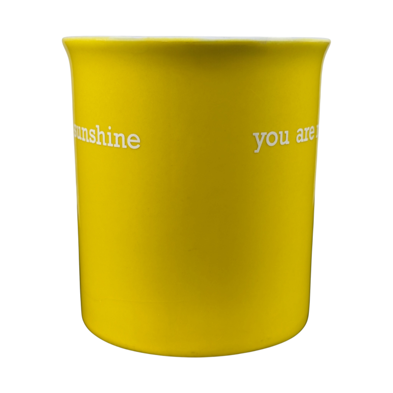 Bright yellow You Are My Sunshine collectible yellow mug featuring whimsical text design
