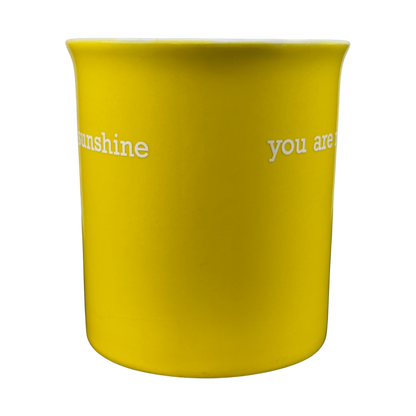 Bright yellow You Are My Sunshine collectible yellow mug featuring whimsical text design