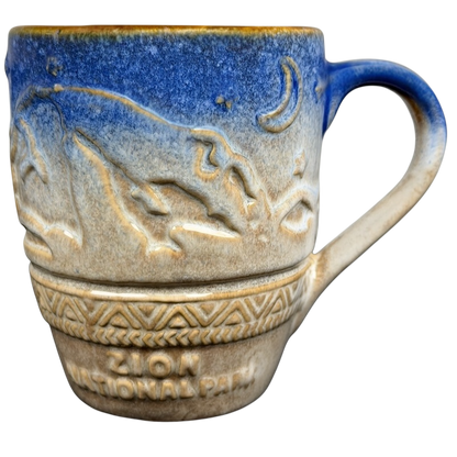 Zion National Park mug featuring embossed mountain design and a blue ombre finish