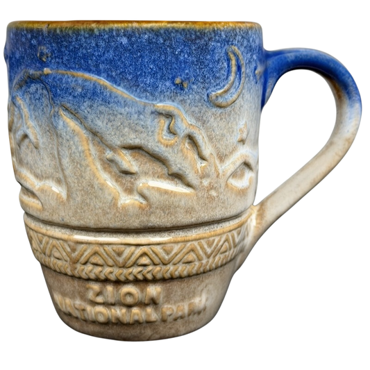 Zion National Park mug featuring embossed mountain design and a blue ombre finish