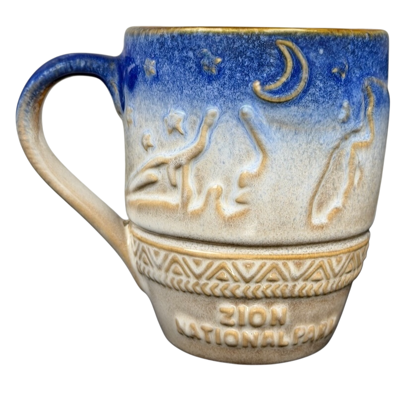 Ceramic Zion National Park mug with a blue and beige design featuring stars and a crescent moon