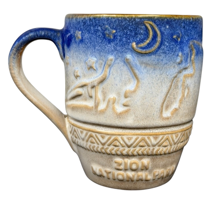 Ceramic Zion National Park mug with a blue and beige design featuring stars and a crescent moon