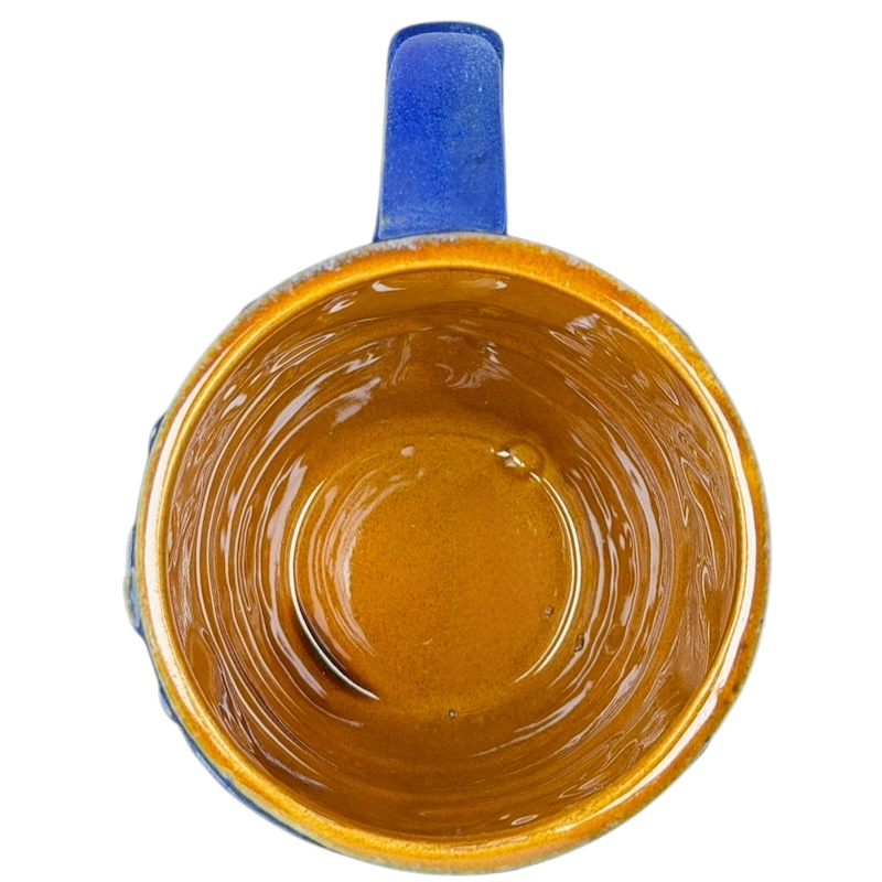 Inside view of a ceramic zion national park mug with a glossy golden brown finish