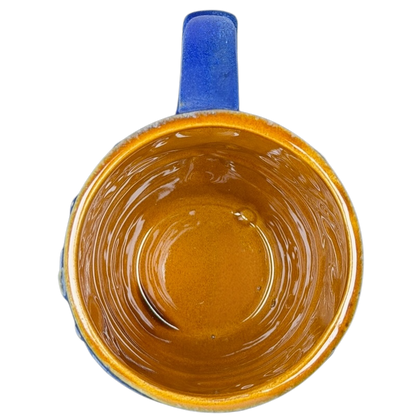 Inside view of a ceramic zion national park mug with a glossy golden brown finish