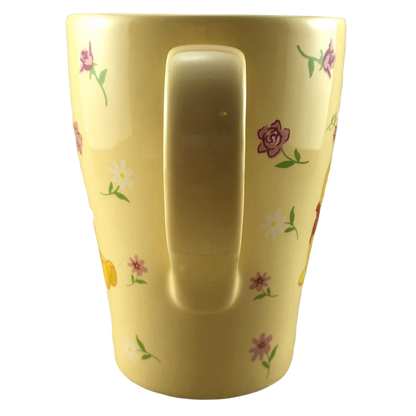 Winnie the Pooh Surrounded By Flowers Yellow Mug Disney Store