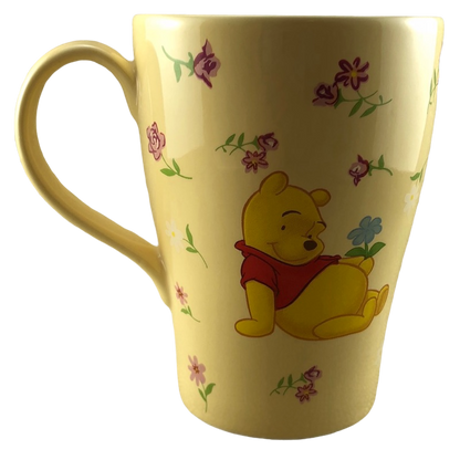 Winnie the Pooh Surrounded By Flowers Yellow Mug Disney Store