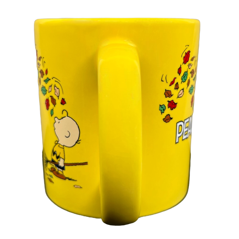 Charlie Brown Raking Colorful Autumn Leaves Mug Peanuts Worldwide