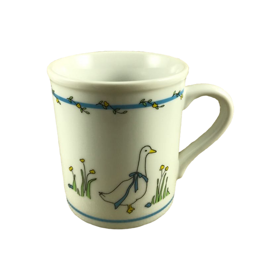 Goose Wearing Bow Among Flowers Mug Papel