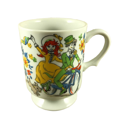 Dog Chasing Boy And Girl On Bicycle Surrounded By Flowers Mug