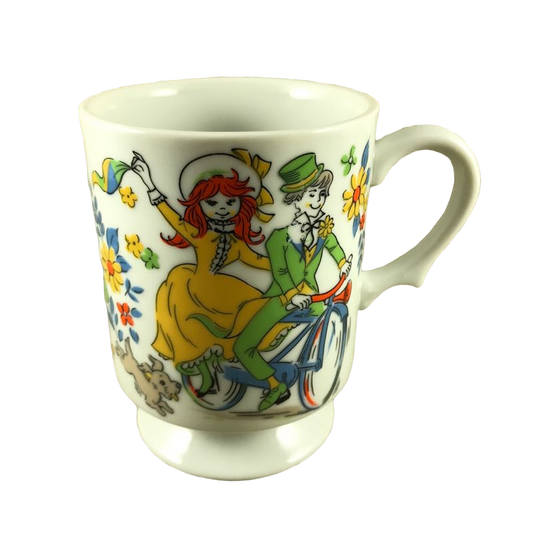 Dog Chasing Boy And Girl On Bicycle Surrounded By Flowers Mug