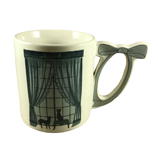 Two Cat Silhouettes Looking Out A Window Bow Handle Mug