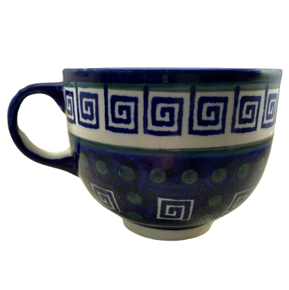 Boleslawiec Polish pottery soup mug featuring a blue and white spiral design with a decorative handle