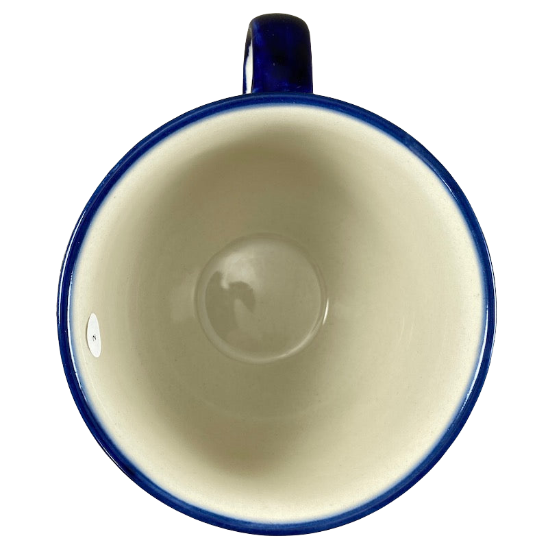 Boleslawiec Polish pottery soup mug with a glossy blue rim and smooth cream interior