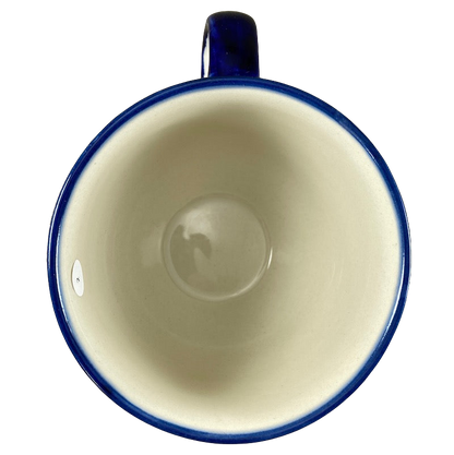 Boleslawiec Polish pottery soup mug with a glossy blue rim and smooth cream interior