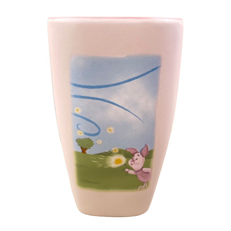 Disneyland Winnie the Pooh Make A Wish vintage mug featuring Piglet blowing dandelion on pastel pink ceramic