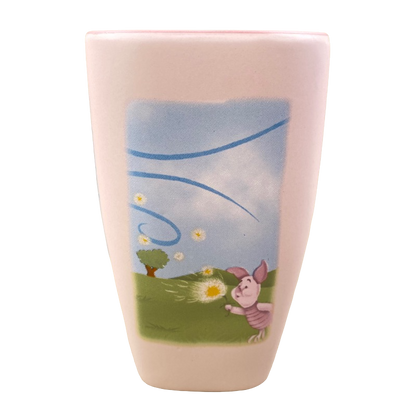 Disneyland Winnie the Pooh Make A Wish vintage mug featuring Piglet blowing dandelion on pastel pink ceramic